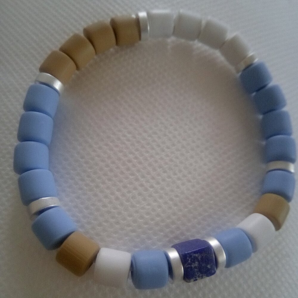 Bracelet...stretch bracelet, midnight blue cube center bead...7 1/2 inches